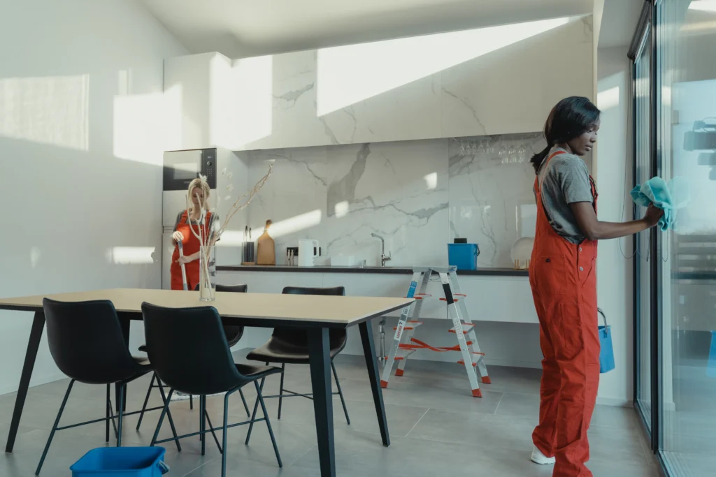 Picture of a cleaner wiping a large glass door